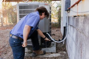 Diamond Air Design team member working on HVAC system