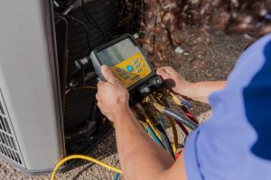 Diamond Air Design team member testing an HVAC system